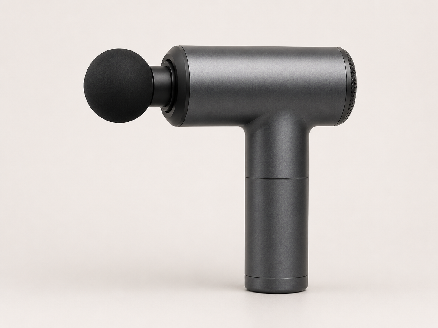 Handheld massage device with dark synthetic leather and rubber touch areas