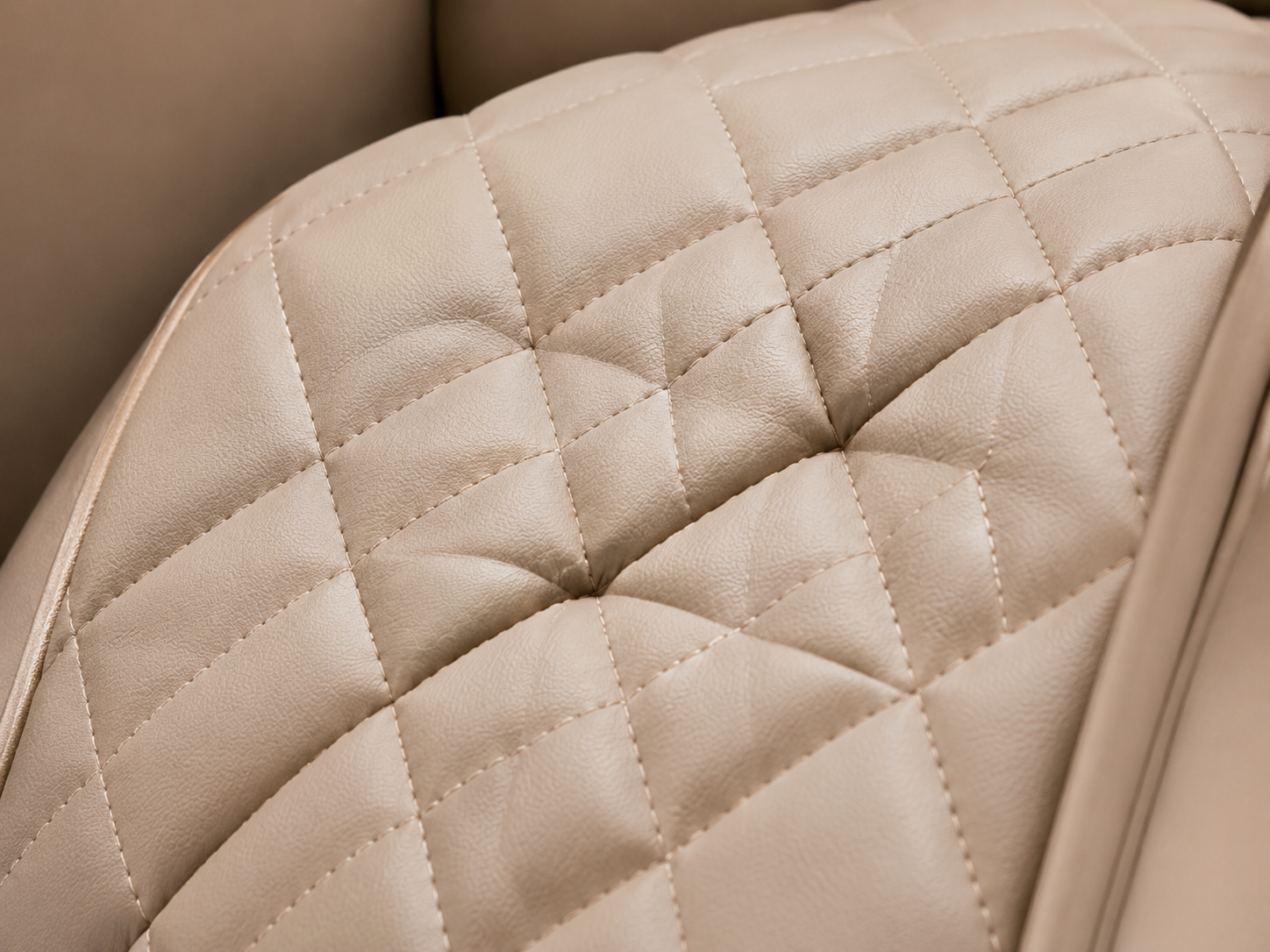 Quilted synthetic leather surface for massage chair seating